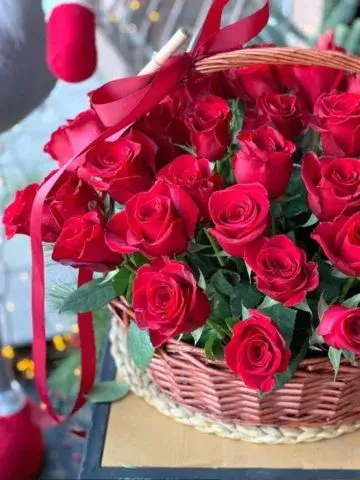 77 roses in a basket